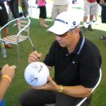 pro golfer signing the autograph ball